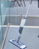 Serenity Hard Floor Misting Mop Kit cleaning hard floor with ergonomic design.